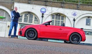 Auto Express contributing editor Steve Sutcliffe standing next to the Audi TT Roadster Final Edition outside Brighton and Hove Albion football club