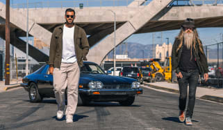 Magnus Walker and Khyzyl Saleem standing in front of a Jaguar XJS