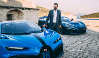 Mate Rimac standing with Bugatti Chiron and Rimac Nevera